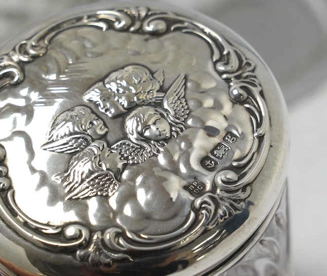 A collection of thirteen assorted late Victorian and later silver topped toilet jars, including blue enamel, tortoiseshell and repousse silver, tallest 9.9cm. Condition - poor to fair to good